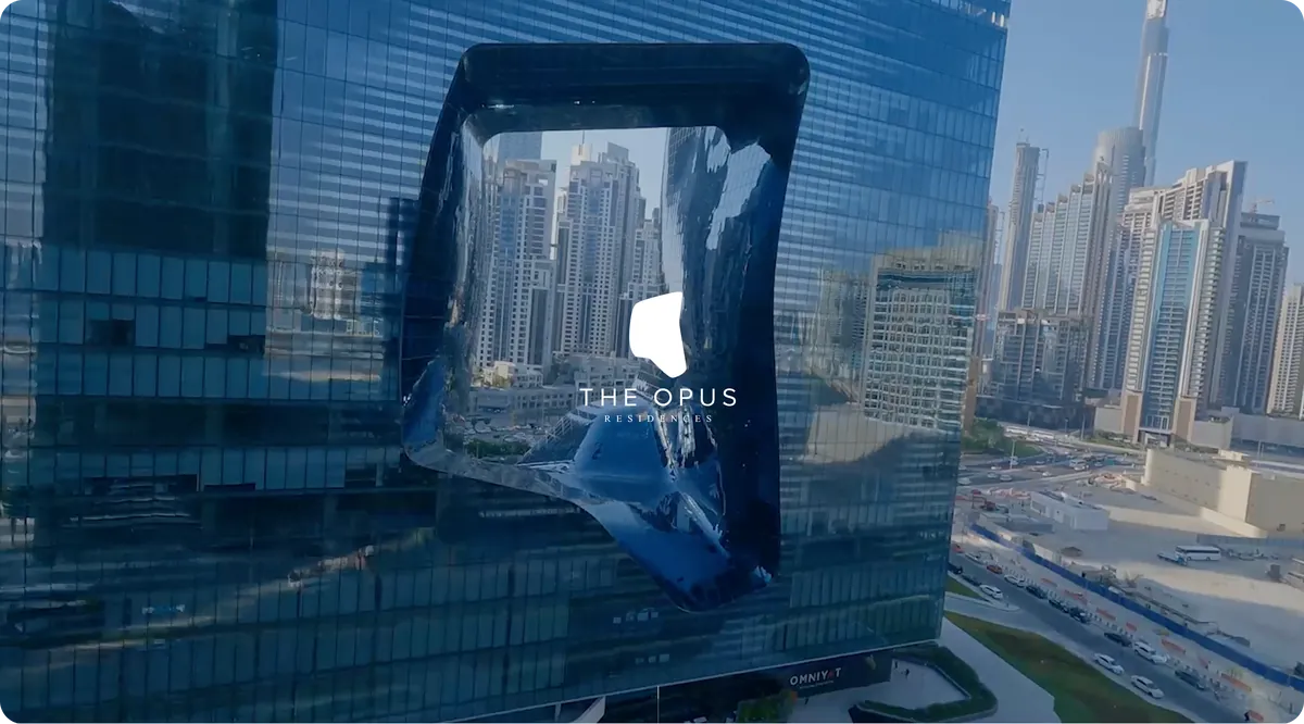 OPUS website hero: the building's sculpted void reflecting the Dubai skyline